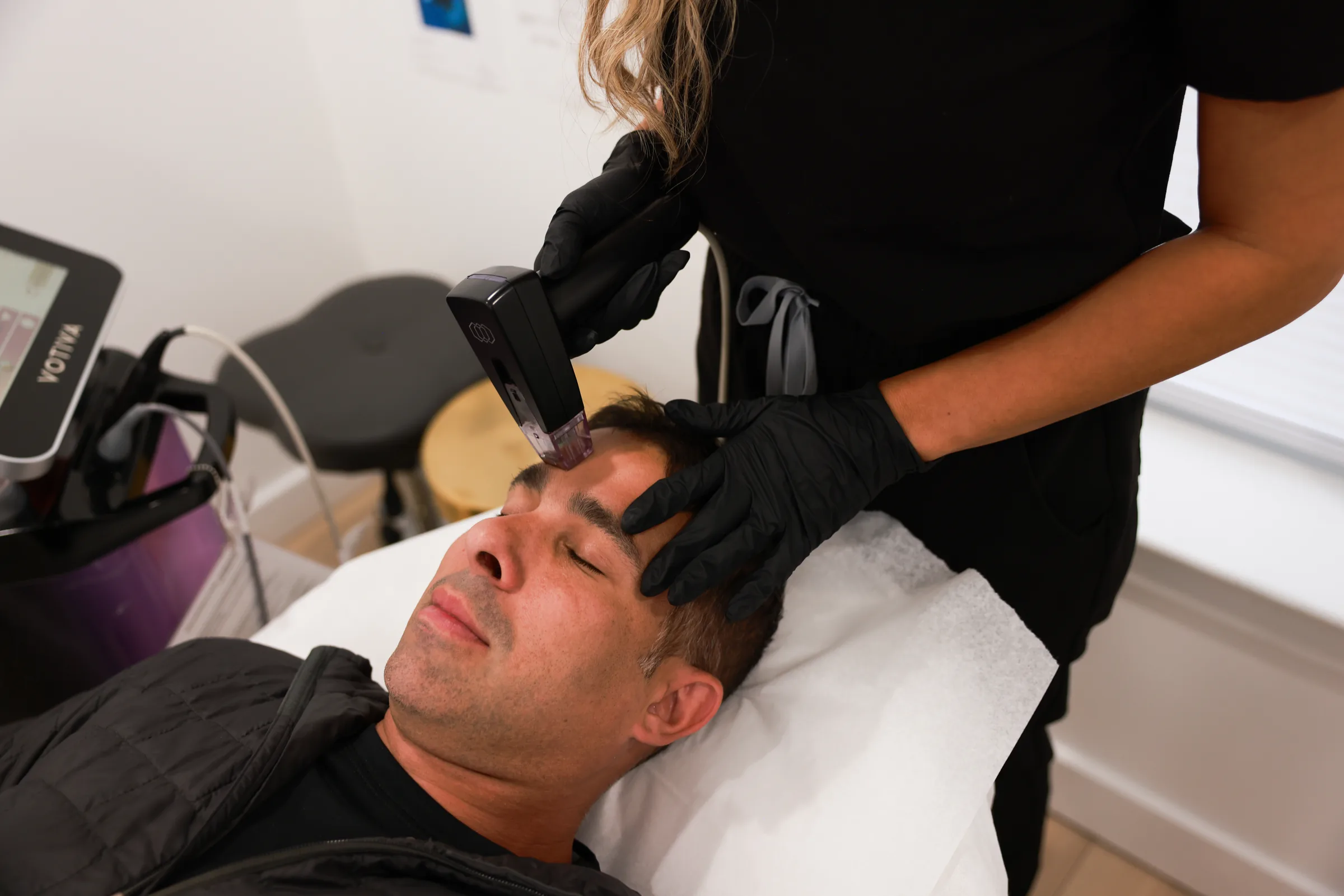 Male patient receiving a facial treatment at Advanced Aesthetics