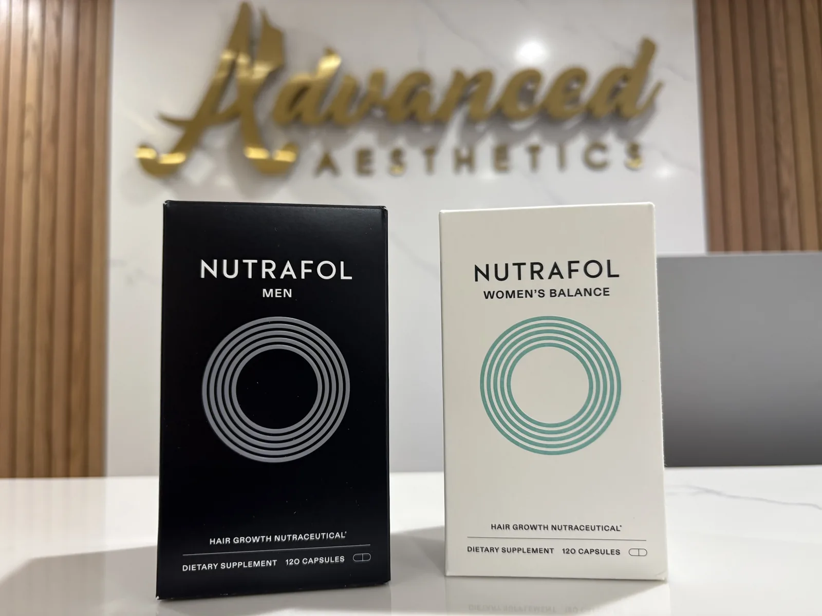 Nutrafol Men and Women's Balance supplement boxes at Advanced Aesthetics