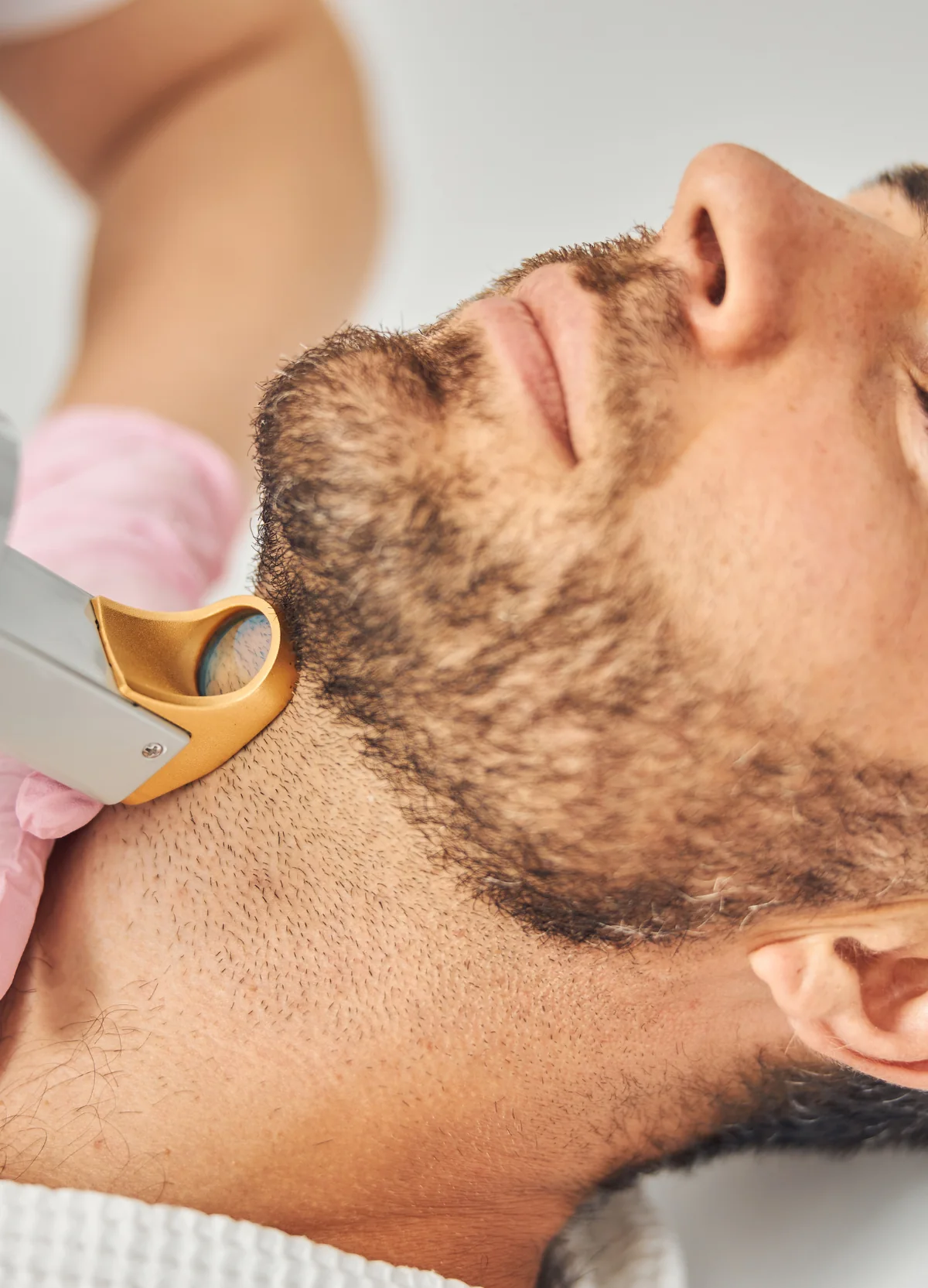 Aesthetic treatment along a man’s neck and jawline