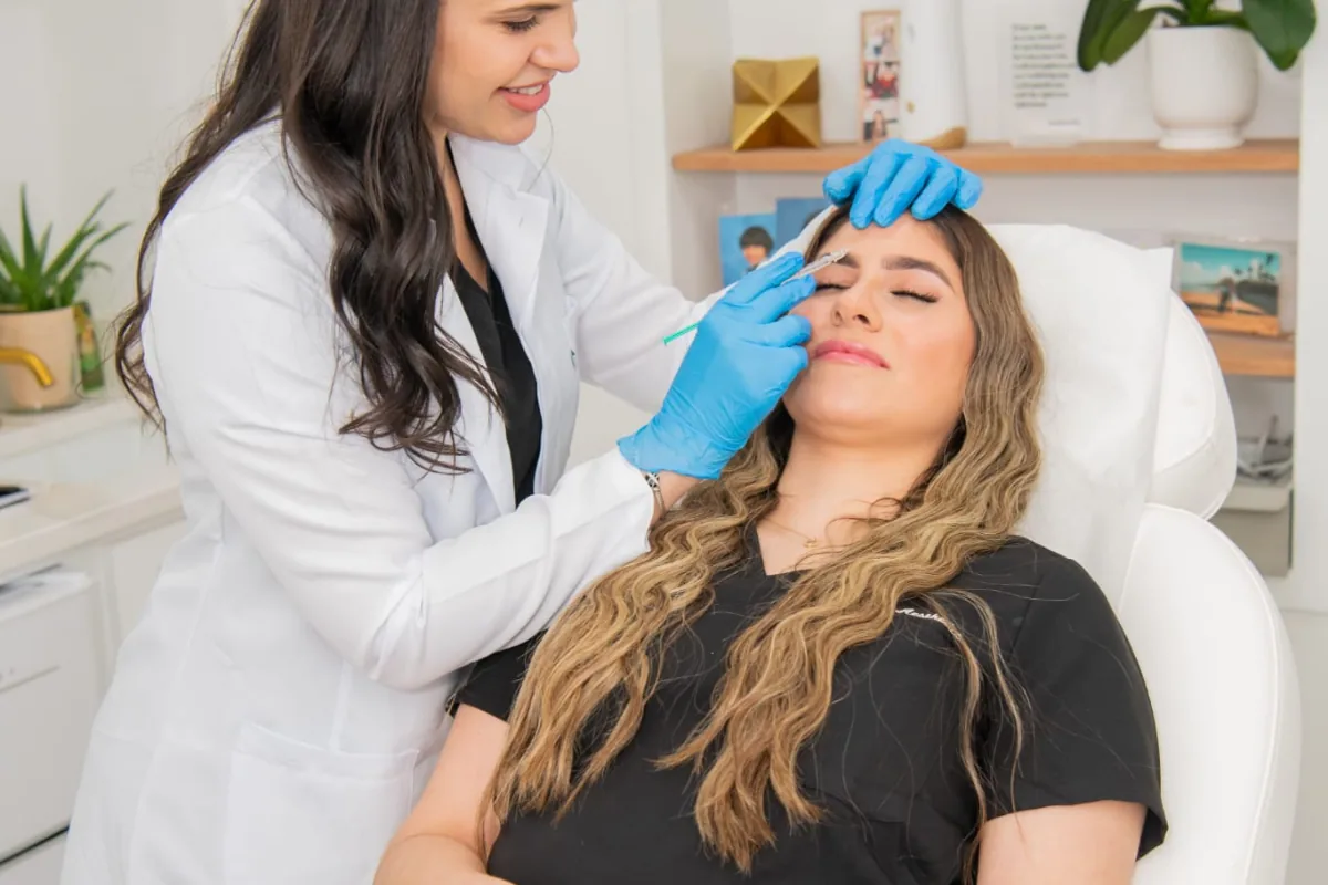 Injector giving a Botox treatment in the treatment room at Advanced Aesthetics, Medford and Braintree MA