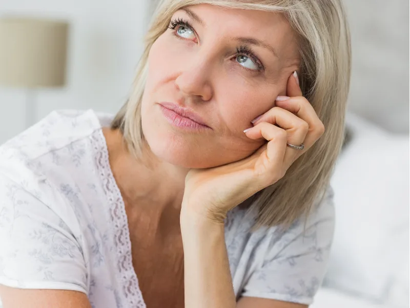 Woman resting her chin on her hand
