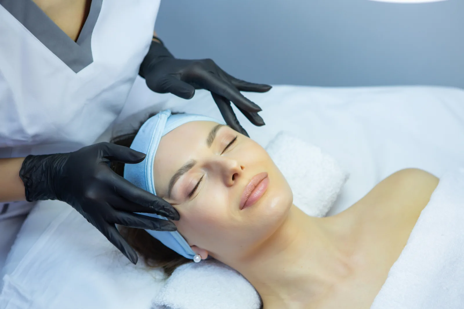 Esthetician giving a customized facial, Signature Facials at Advanced Aesthetics, Medford and Braintree MA